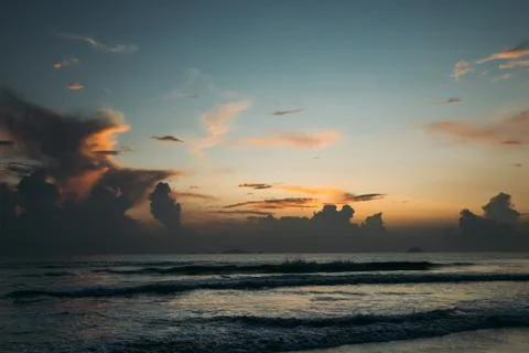 Beautiful sunrise, sunset of the sun through the clouds Stock Photos