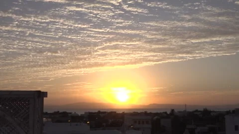 Beautiful sunrise timelapse with streaming clouds and birds in the sky Stock Footage 268950309