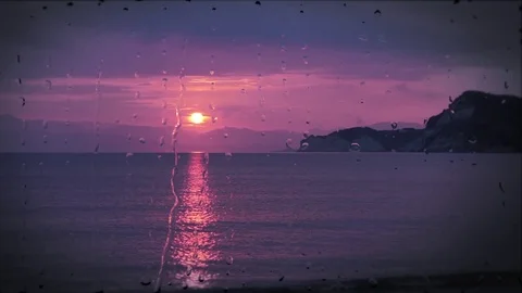 Beautiful sunrise while raining. Watching the sunrise behind the window 動画素材 71183150