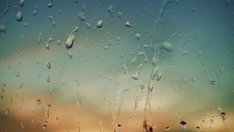 Beautiful sunrise while raining. Watching the sunrise behind the window. 4K Stock Footage 83501946