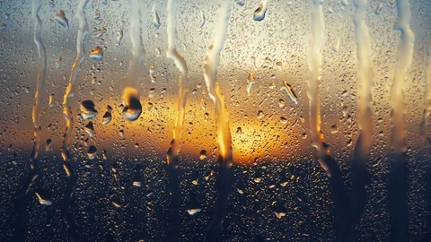 Beautiful sunrise while raining. Watching the sunrise behind the window. 4K Stock Footage 83535458