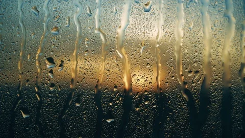 Beautiful sunrise while raining. Watching the sunrise behind the window. 4K Video stock 83536022