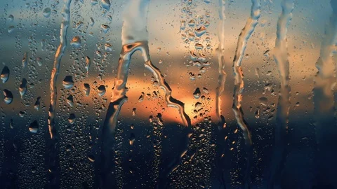 Beautiful sunrise while raining. Watching the sunrise behind the window. 4K Video stock 83537945