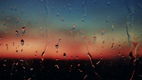 Beautiful sunrise while raining. Watching the sunrise behind the window. 4K Video stock 83540436