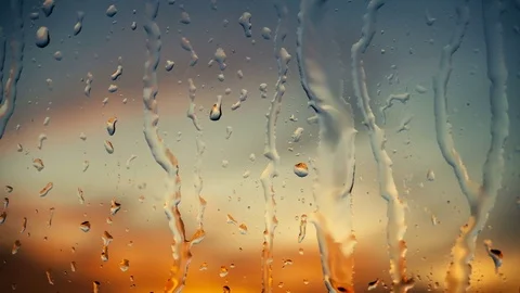 Beautiful sunrise while raining. Watching the sunrise behind the window. 4K Stock Footage 83580897