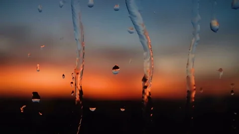 Beautiful sunrise while raining. Watching the sunrise behind the window. 4K Stock Footage 83583689