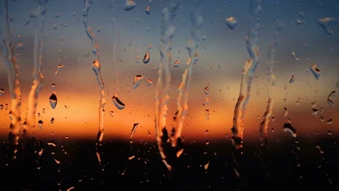 Beautiful sunrise while raining. Watching the sunrise behind the window. 4K Video stock 84256683