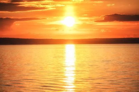 Beautiful sunset above the river Stock Photos