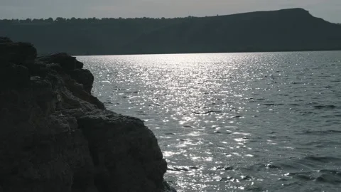 Beautiful sunset against the background of the river and hills Stock Footage 256293667