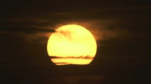 The beautiful sunset against the cloud. Real time capture. Telephoto lens Stock Footage 63778573