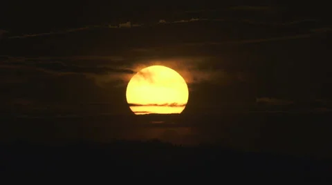 The beautiful sunset against the cloud. Real time capture. Telephoto lens Stock Footage 63778638