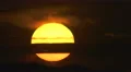 The beautiful sunset against the cloud. Real time capture. Telephoto lens 4k or 4k+ Resolution