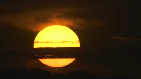 The beautiful sunset against the cloud. Real time capture. Telephoto lens Stock-Footage 63778913