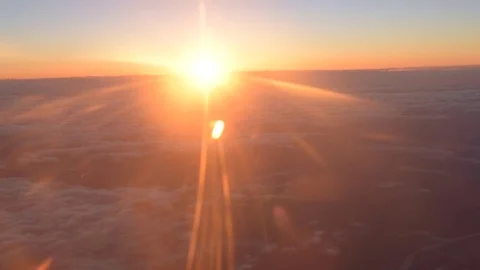 Beautiful sunset from an airplane above the clouds, background Stock Footage 79995608