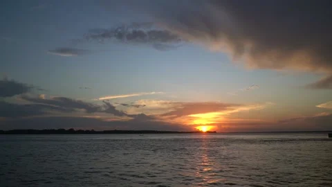 Beautiful sunset on the Amazonas River and gorgeous clouds at dusk in Amazon. Stock Footage 150891610