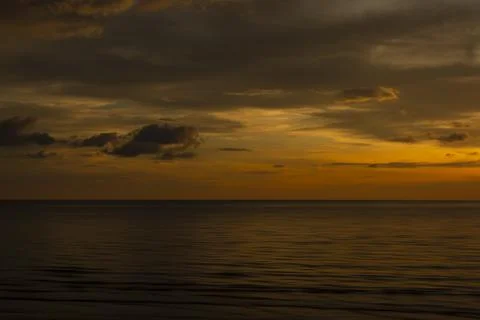 Beautiful sunset background at the beach motion blur. Stock Photos