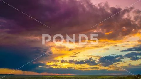 The beautiful sunset on the background of cloud stream. Wide angle Stock Photos