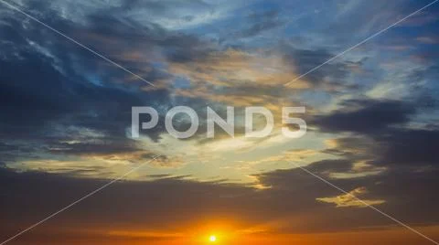The beautiful sunset on the background of cloud stream. Wide angle Stock Photos
