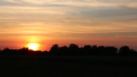 Beautiful sunset on a background of clouds. Stock Footage 132855789