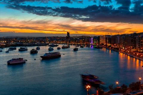 Beautiful sunset in the bay of Sliema, Malta. Stock Photos
