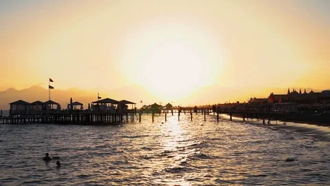 Beautiful sunset at the beach amazing colors light beam shining through the Stock Footage 99692653
