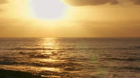 Beautiful sunset at the beach creating the perfect scenery for evening walks at Stock-Footage 121438051