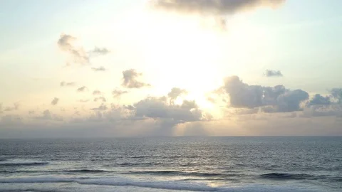 Beautiful sunset at beach, light beam shining through cloudscape Bali Indonesia Stock Footage 83716602