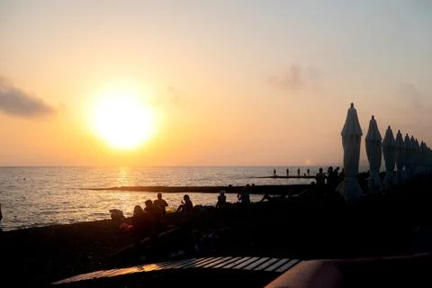 Beautiful sunset of the beach in the sunset rays of the sun. A romantic setting Stock Photos
