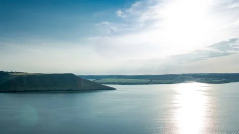 A beautiful sunset behind the ocean and mountains. Stock Footage 77585347