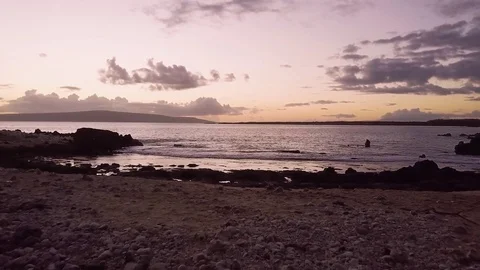 Beautiful Sunset Captured Reflecting Off Shore On A Tropical Beach Video stock 83733803