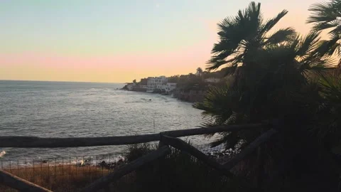 Beautiful sunset casting a golden light over the tyrrhenian sea coastline in Stock Footage 340271495