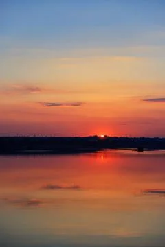 Beautiful sunset with clouds in the foreground. Vertical Stock Photos