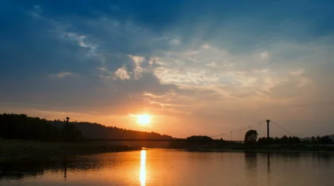 Beautiful sunset with clouds an sky and river, time lapse. Stock Footage 46730612
