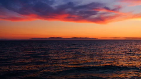 A beautiful sunset in the clouds, on the surface of the ocean Stock Footage 92205986
