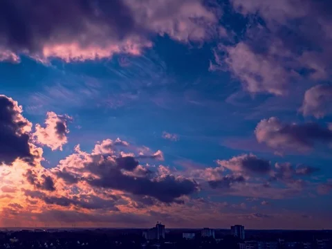 Beautiful sunset with cloudscape and multicolored evening glowing over skyline Stock Footage 125129622