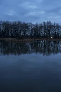 Beautiful sunset with dramatic clouds and reflections in the water during b.. Stock Photos