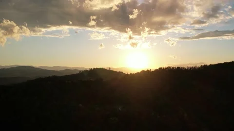 Beautiful sunset with drone. In the foreground a mountain Stock Footage 200974695