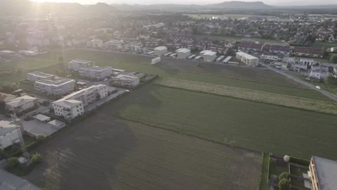 Beautiful sunset with drone. In the foreground a small town 스톡 동영상 200978389