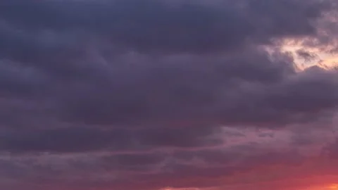 Beautiful sunset at dusk, clouds colored red, from light to darkness 動画素材 150407938