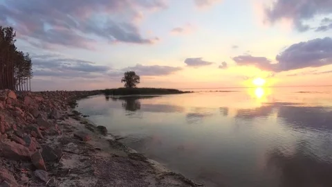 Beautiful sunset on the evening lake. TimeLapse Stock Footage