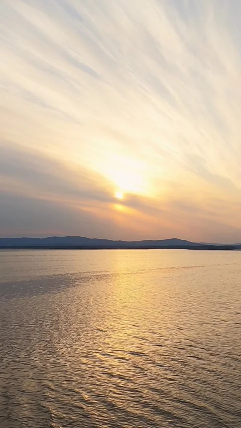 Beautiful sunset on the lake. Cloudy sky, sunlight. Stock Footage 293140730