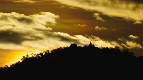 Beautiful sunset landscape over dramatic mountain silhouettes with golden sky Stock Footage 286177705