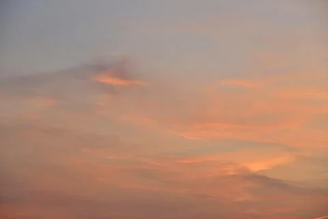 Beautiful sunset light and clouds and a trace of the plane. Evening sunset la Stock Photos