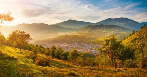 Beautiful sunset light over mountain landscape timelapse Stock Footage 129697760