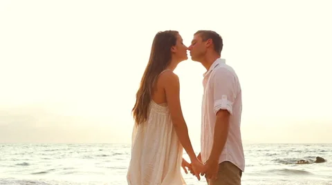 Beautiful Sunset Light on Romantic Young Couple Holding Hands. Warm Lens Flar Stock Footage 52553252