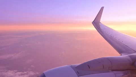 Beautiful sunset looking from an airplane window Stock Footage 133853547