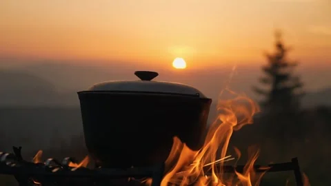 Beautiful sunset in the mountains. Against the background of the sunset, a Stock Footage 272268902