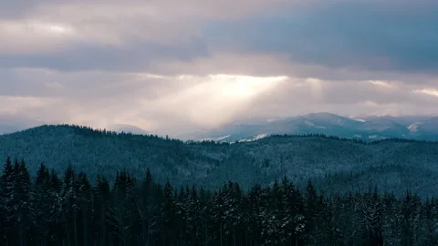 Beautiful sunset in the mountains. the rays of the sun shine between the clouds Stock Footage 147253455
