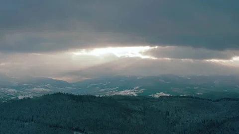 Beautiful sunset in the mountains. the rays of the sun shine between the clouds Stock Footage 147253837