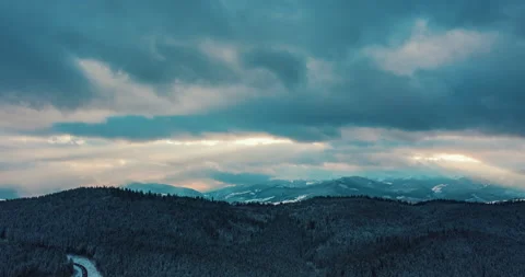 Beautiful sunset in the mountains. the rays of the sun shine between the clouds Stock Footage 147493709